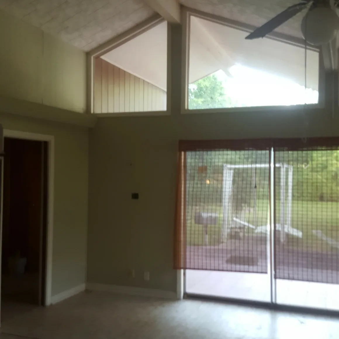 A large open living room with sliding glass doors.