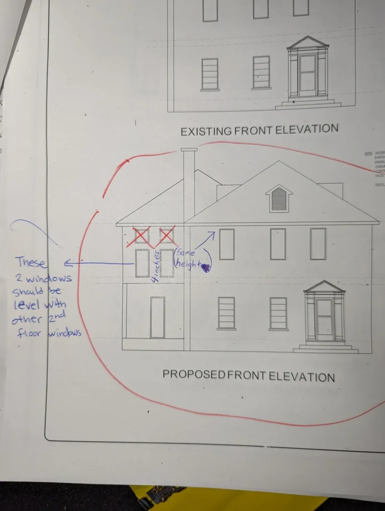 A drawing of an old house with the instructions for elevating.