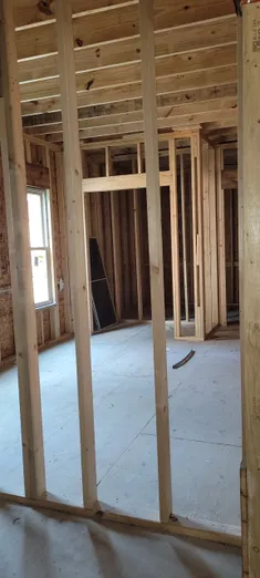 A room with some wood framing in it