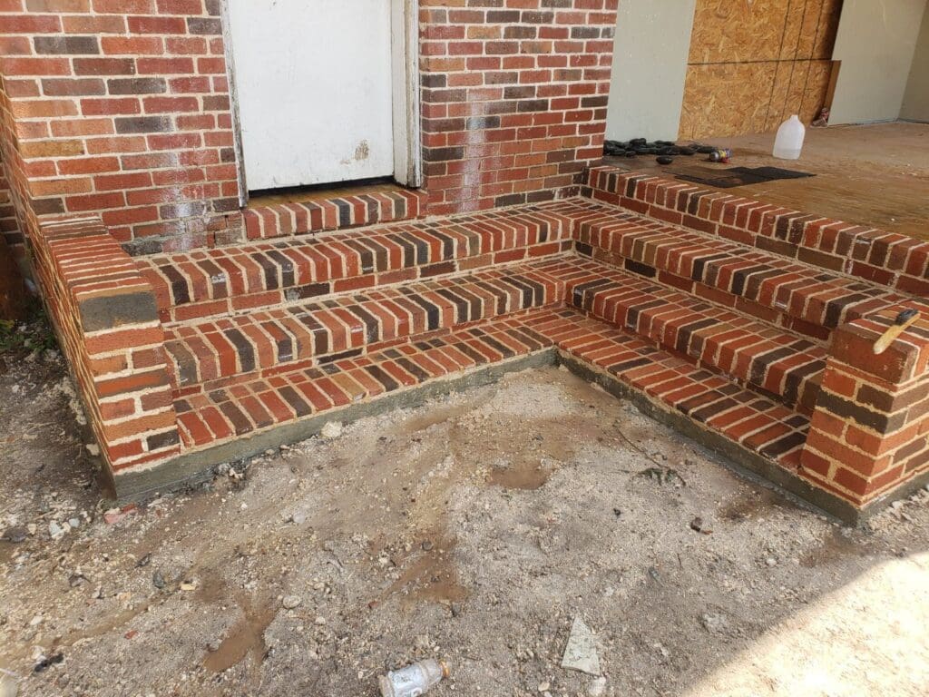 A brick staircase that is being built.